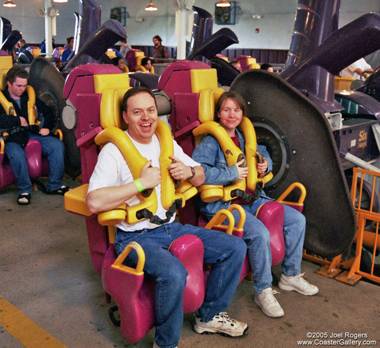 Restraint systems on X roller coaster