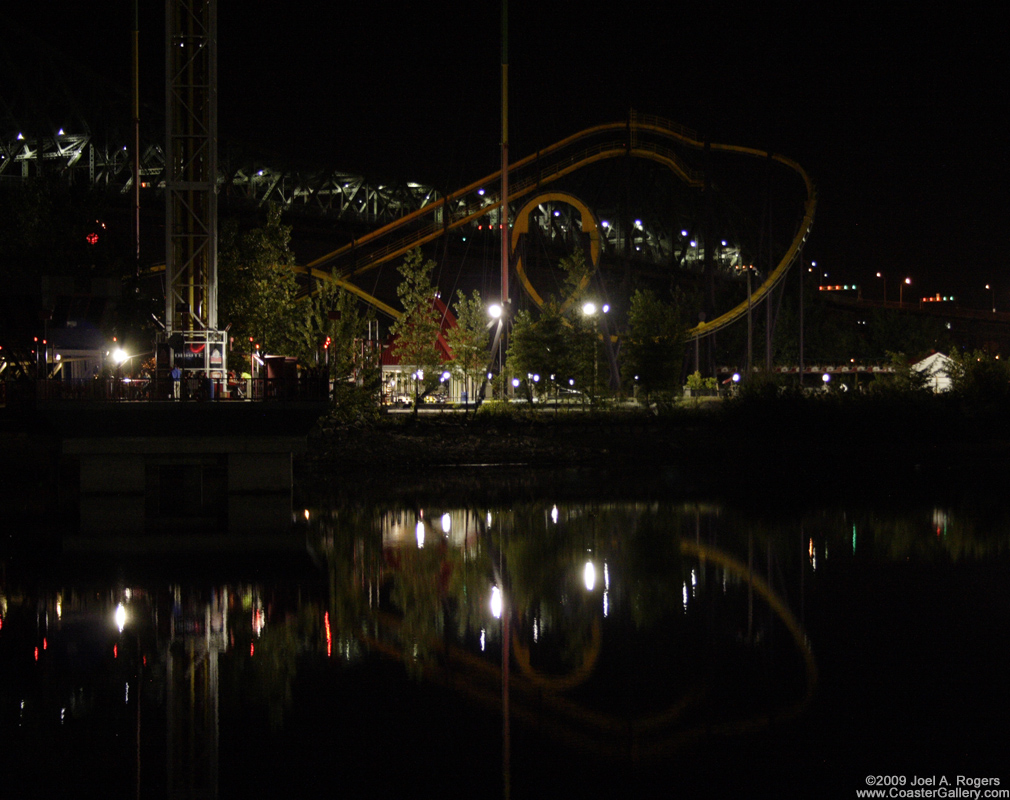 Night time reflections of a roller coaster