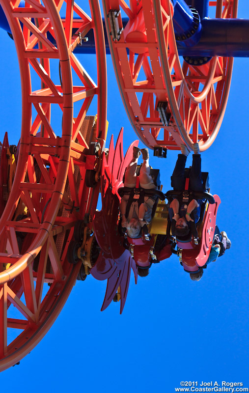 Abstract photo of riders on a spinning roller coaster