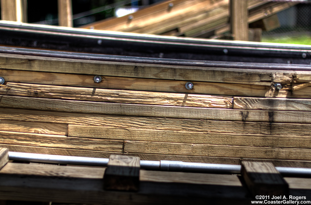 Close up picture of wooden roller coaster track