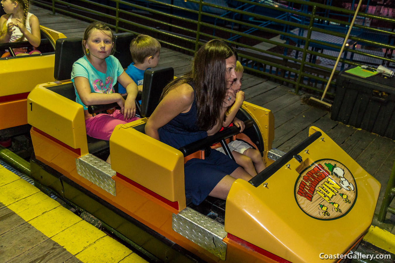 A picture of kids riding the Wilderness Run roller coaster at Camp Snoopy at Cedar Point in Sandusky, Ohio
