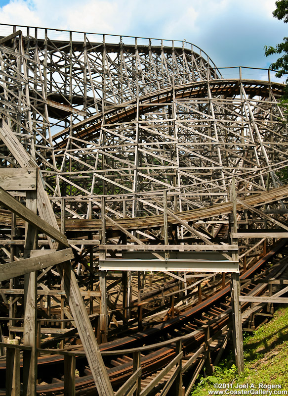 Stock photography of a twisted wooden roller coaster