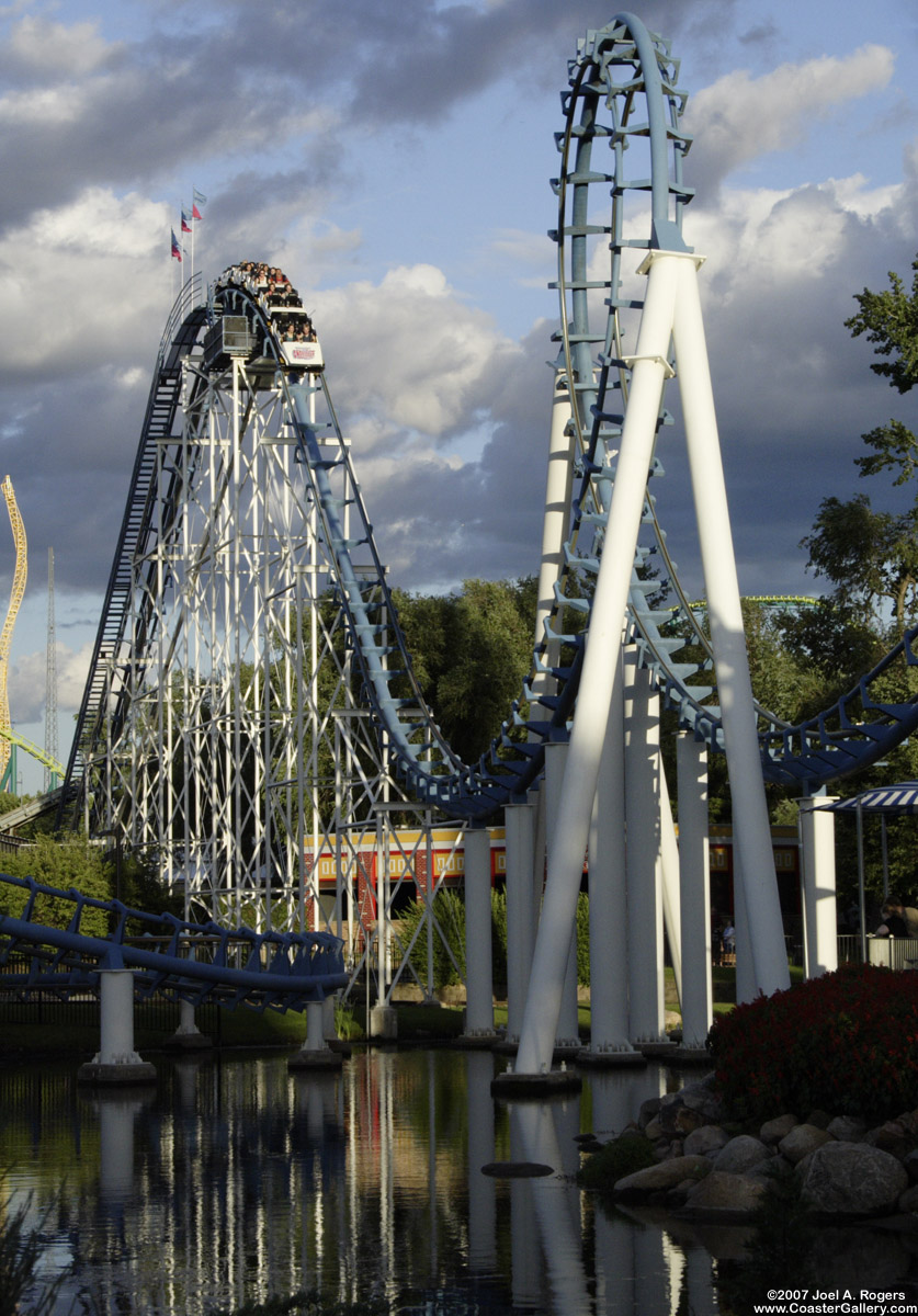 Corkscrew roller coaster reflection in the water