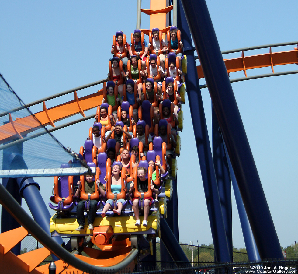 A train full of passengers on a floorless roller coaster