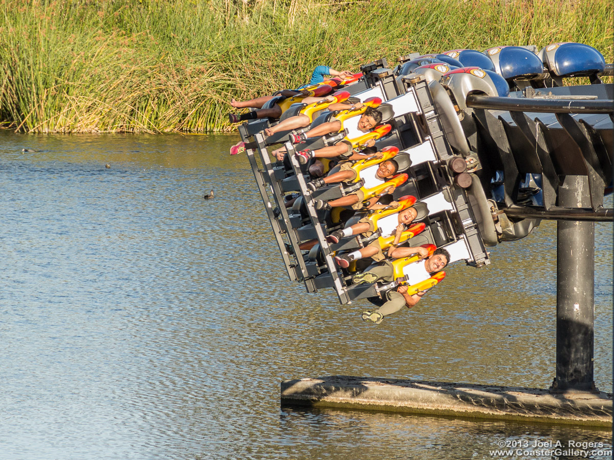 An inverted roller coaster skimming right over the water