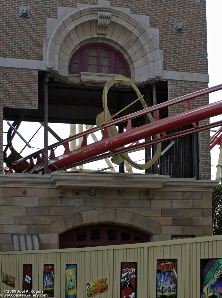 Roller coaster going through a building