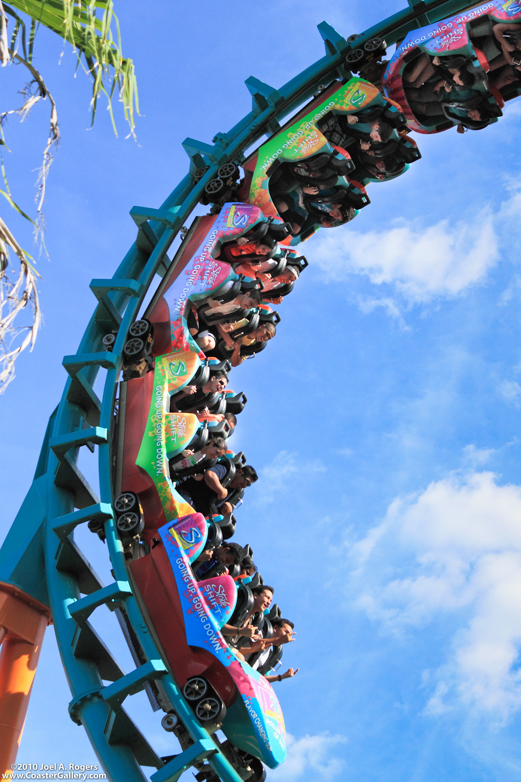 Stock image of a roller coaster covered in advertising