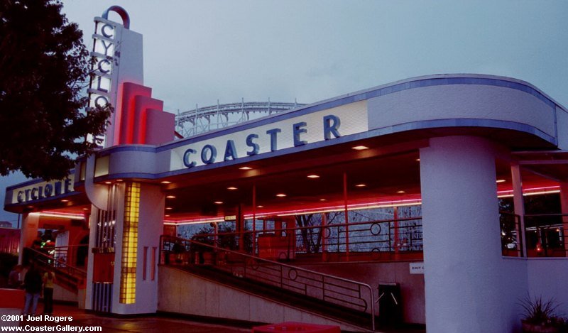 Cyclone roller coaster at night. Neon lights on its Art Deco Station.