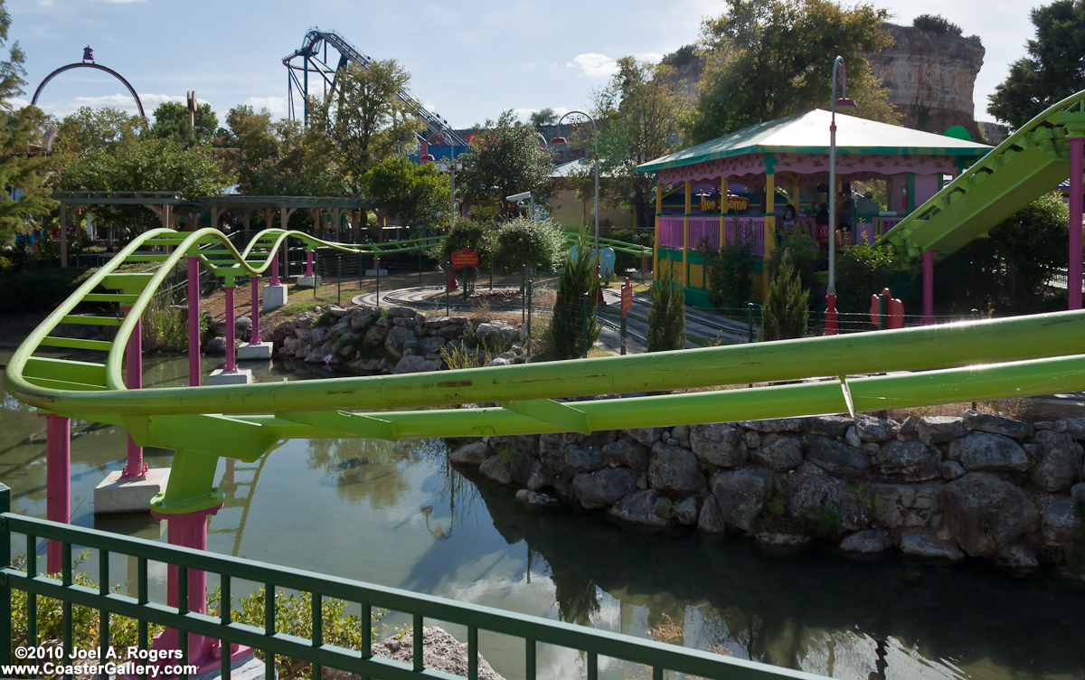 A Six Flags Fiesta Texas roller coaster going over the water