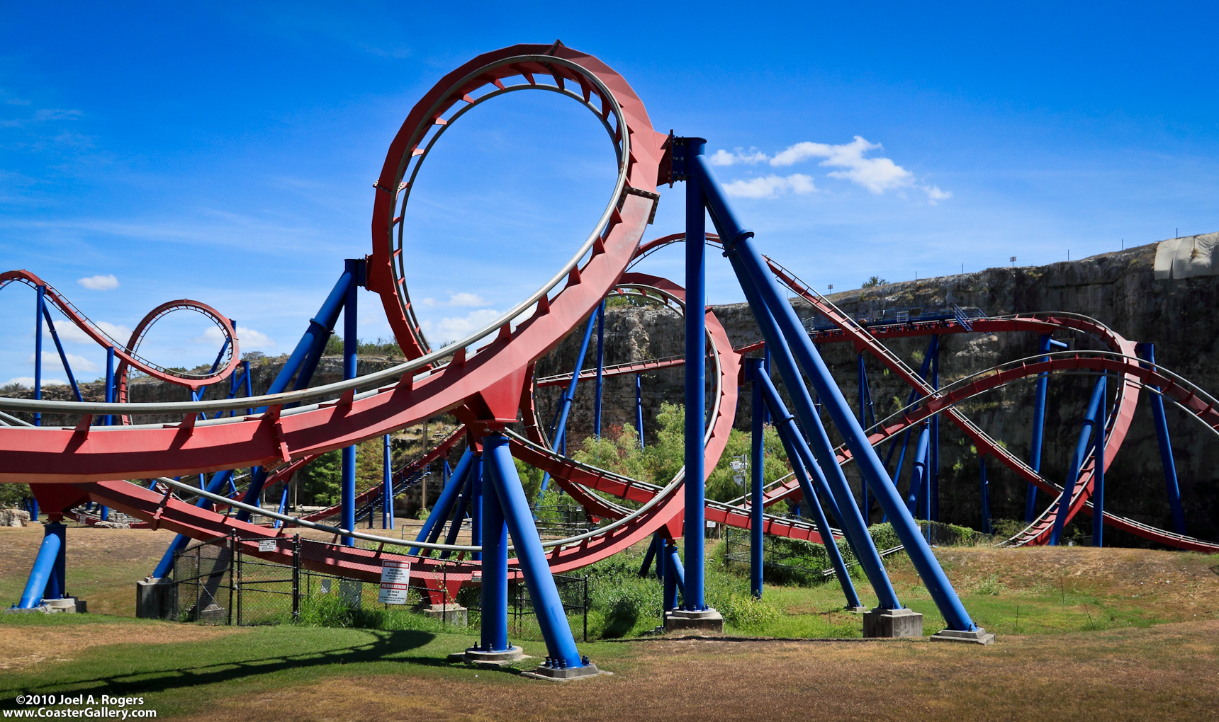 A tangle of red and blue metal. One of the best roller coasters.