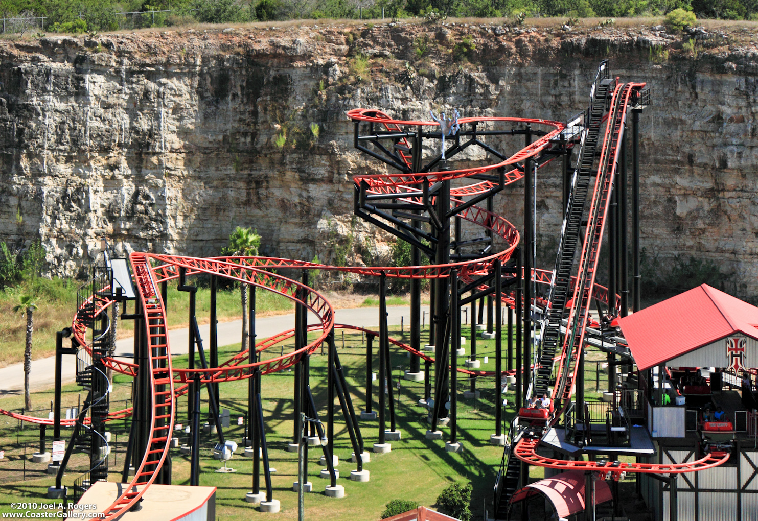 Looking down on the Pandemonium roller coaster and a cliff