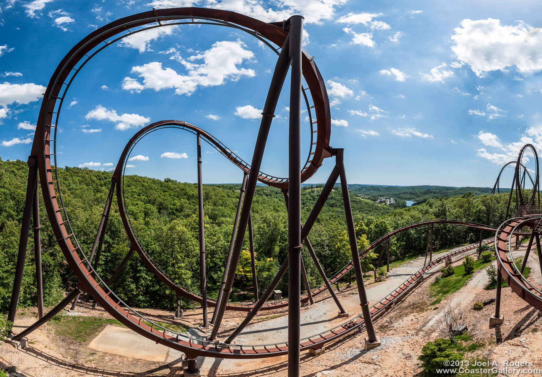 Panorama of a corbra roll loop on a B&M roller coaster at Silver Dollar City.