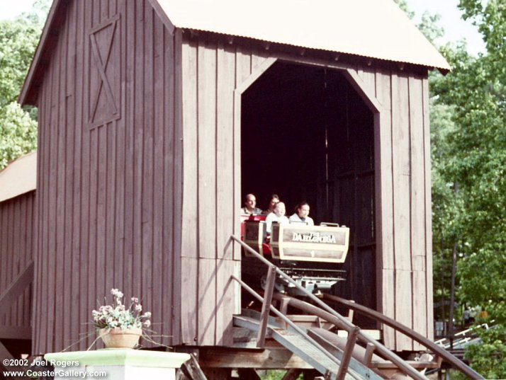 Dahlonega Mine Train roller coaster going through a building