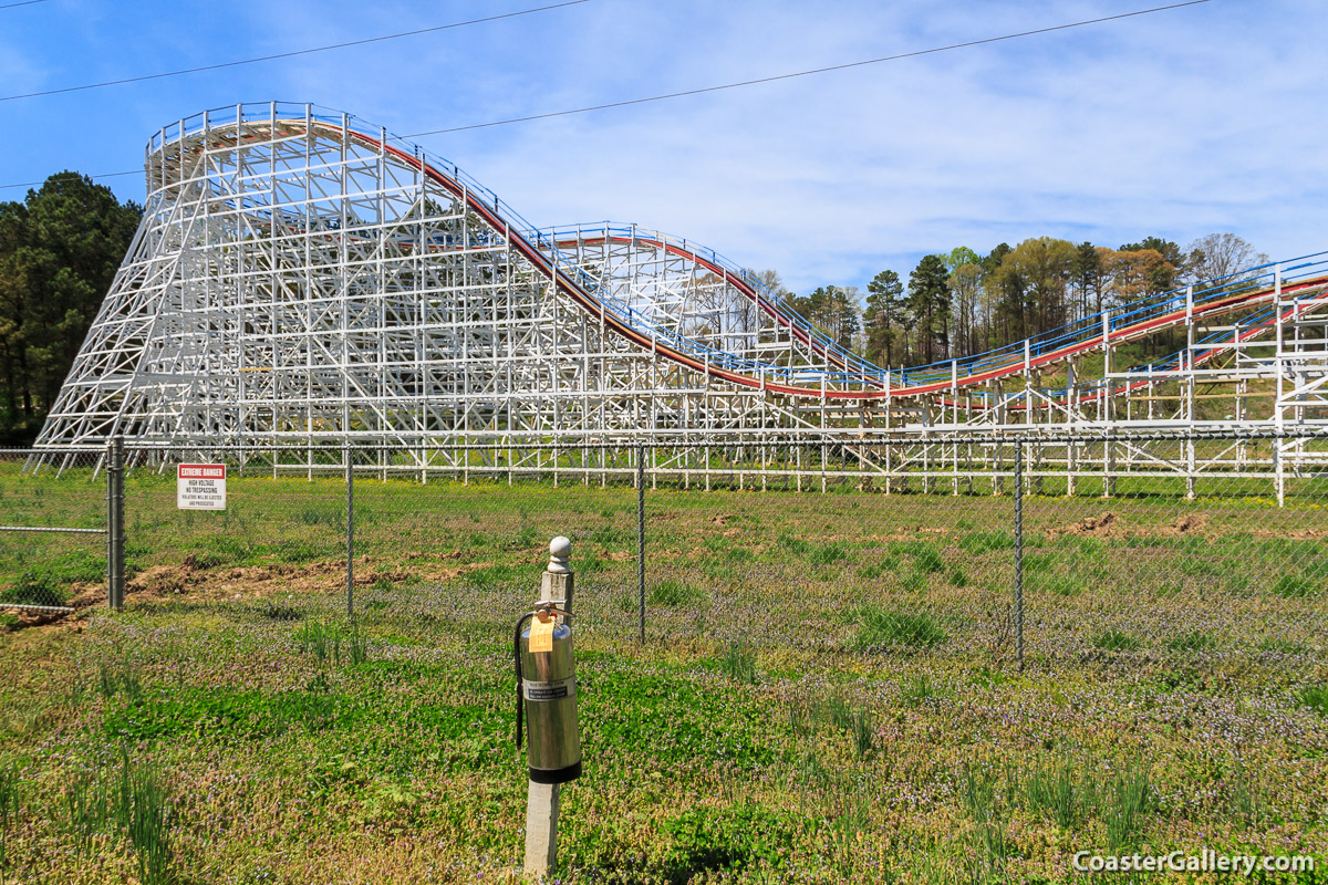 Roller coaster fire prevention and a handheld fire extinguisher