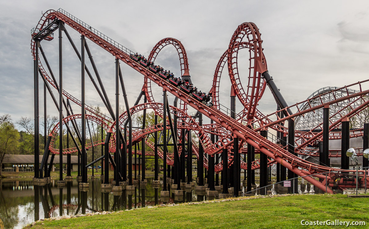 Ninja looping roller coaster reflected in the water