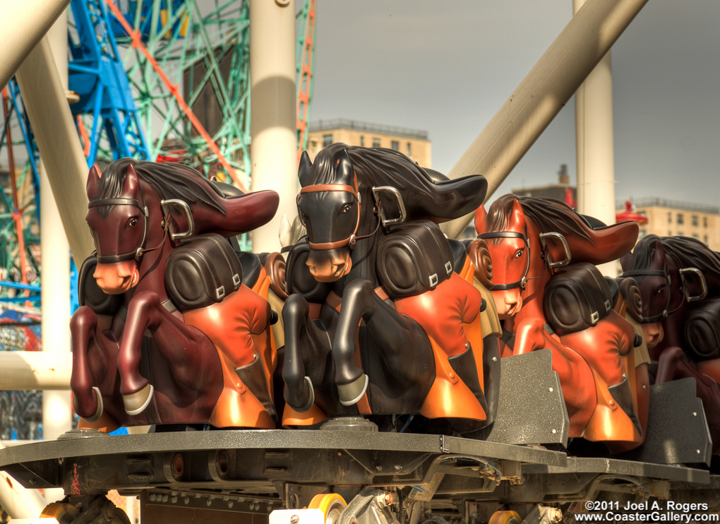 Racing horses on a steeplechase roller coaster