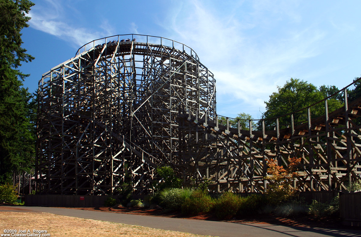 A wooden roller coaster running with PTC trains