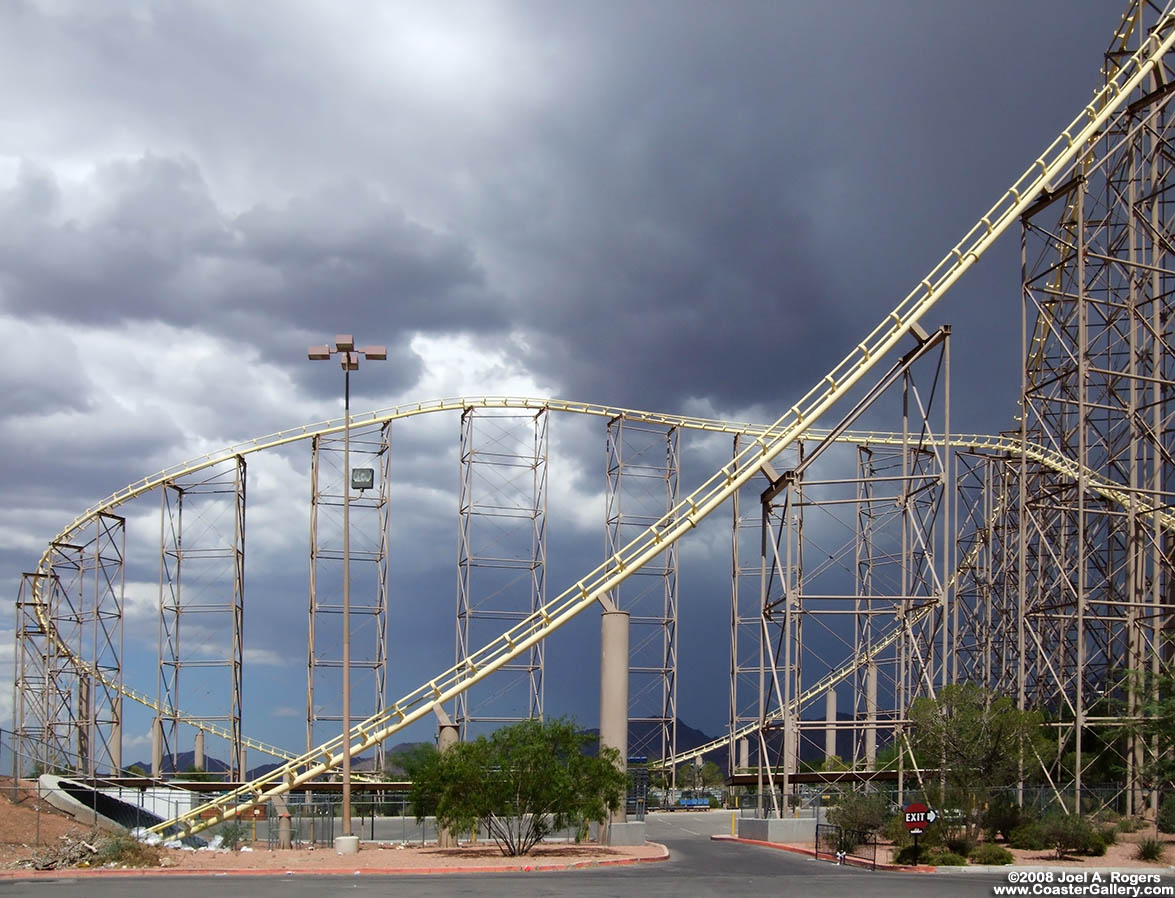 Roller coaster track leaving a tunnel