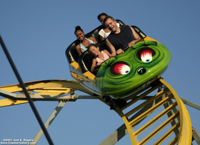 Four riders enjoying a roller coaster