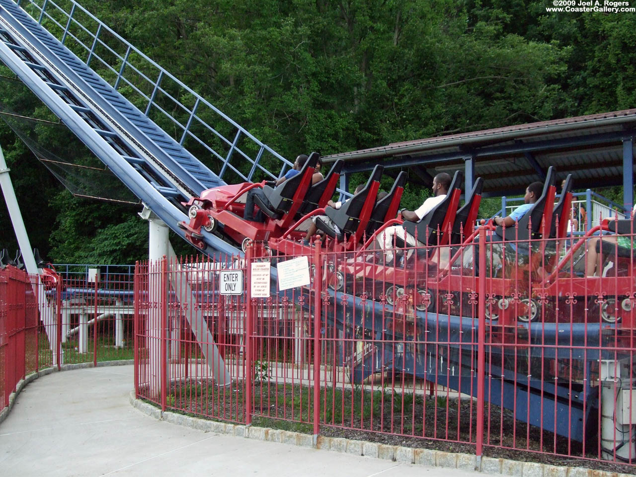 Red train heading out of the station