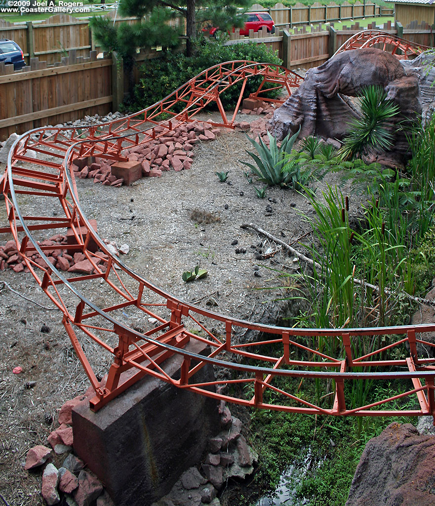 Cat tails, a stream, rocks, cacti, and a roller coaster