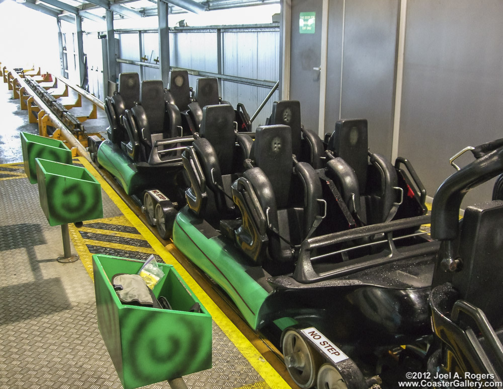Roller coaster restraints and safety systems