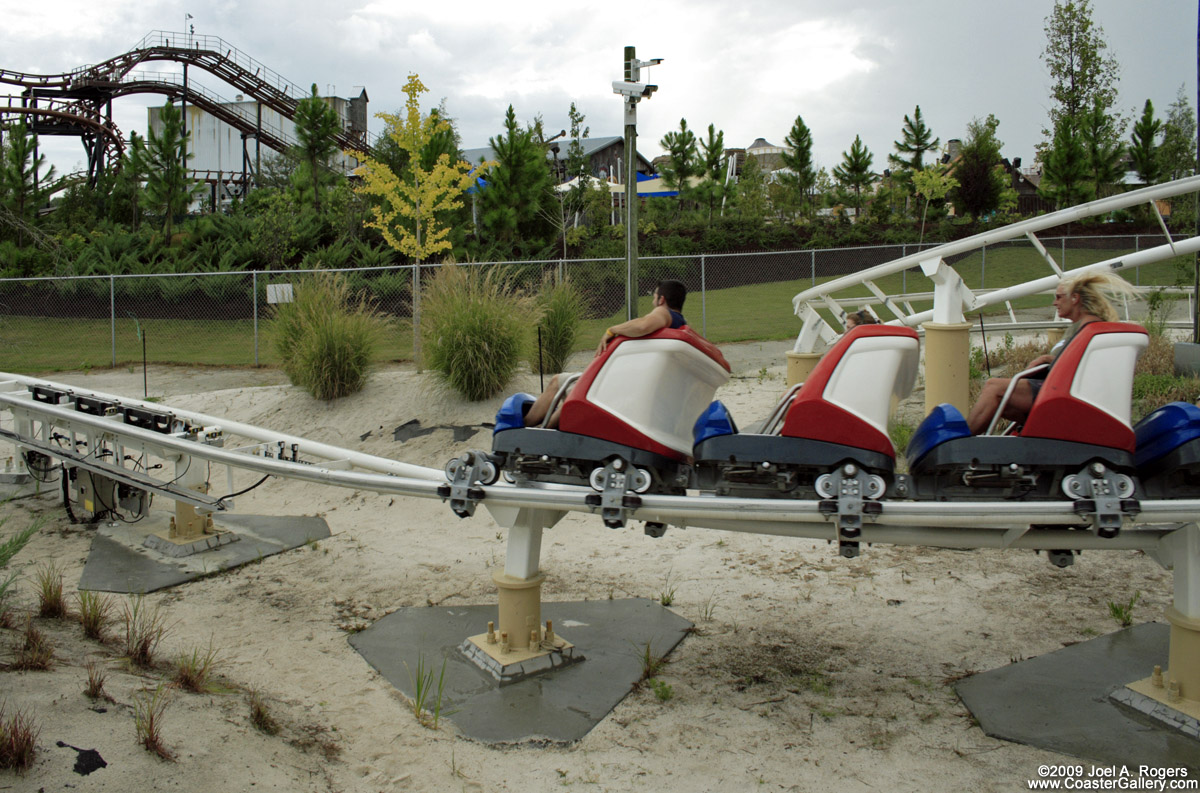 A roller coaster gliding over the dunes