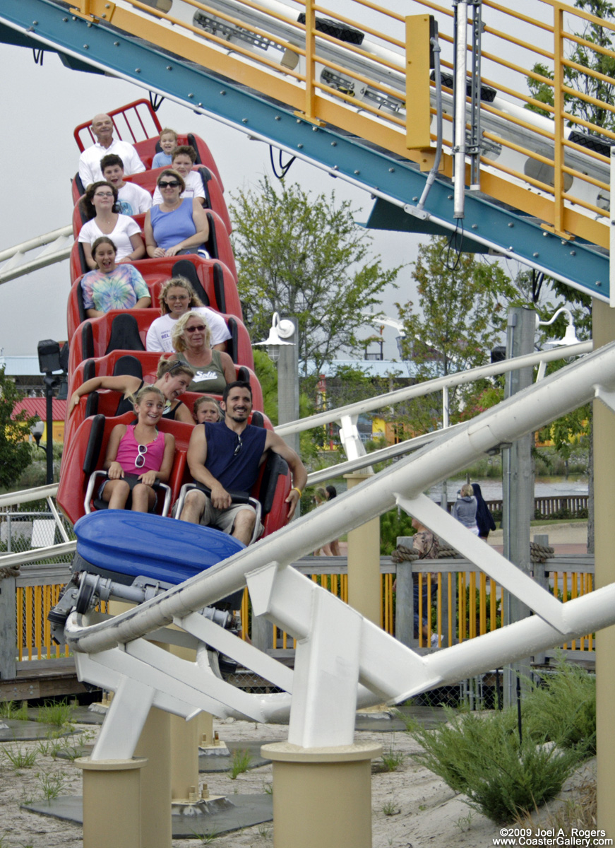 A vekoma roller coaster diving underneath a lift hill