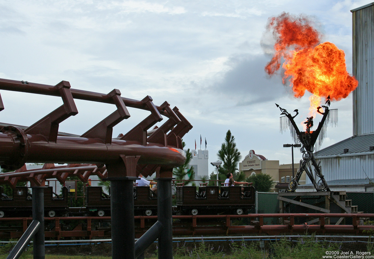 Large ball of fire shooting up over a train