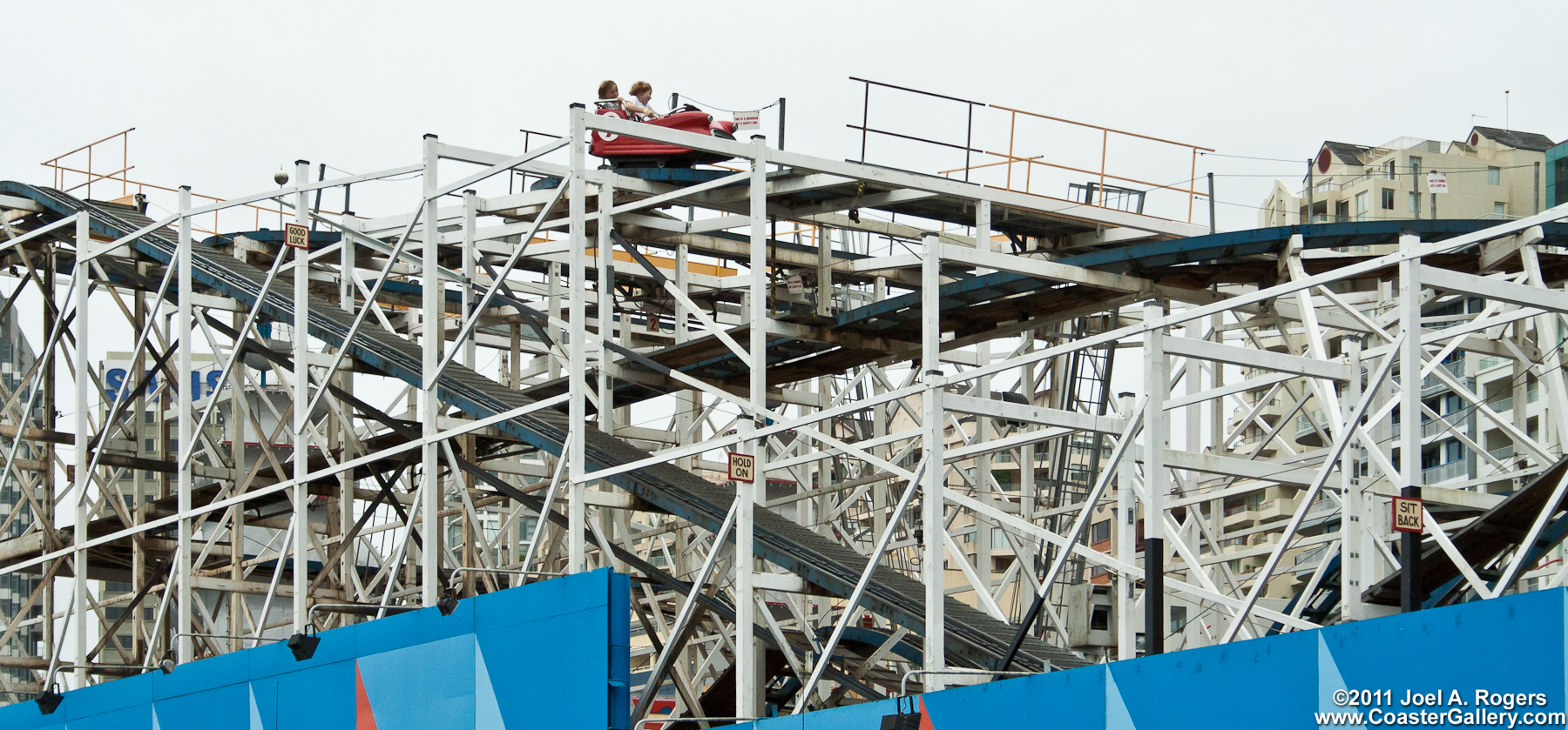 Safety signs on a wooden Wild Mouse roller coaster