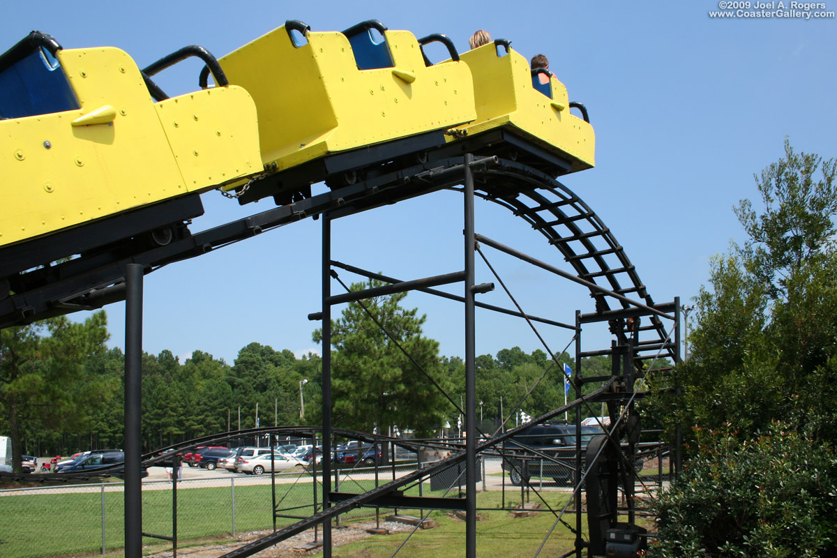 Small roller coaster climbing the lift hill