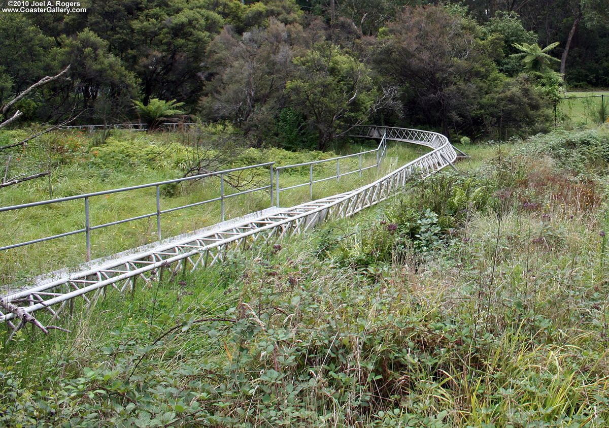 A roller coaster with tilting cars