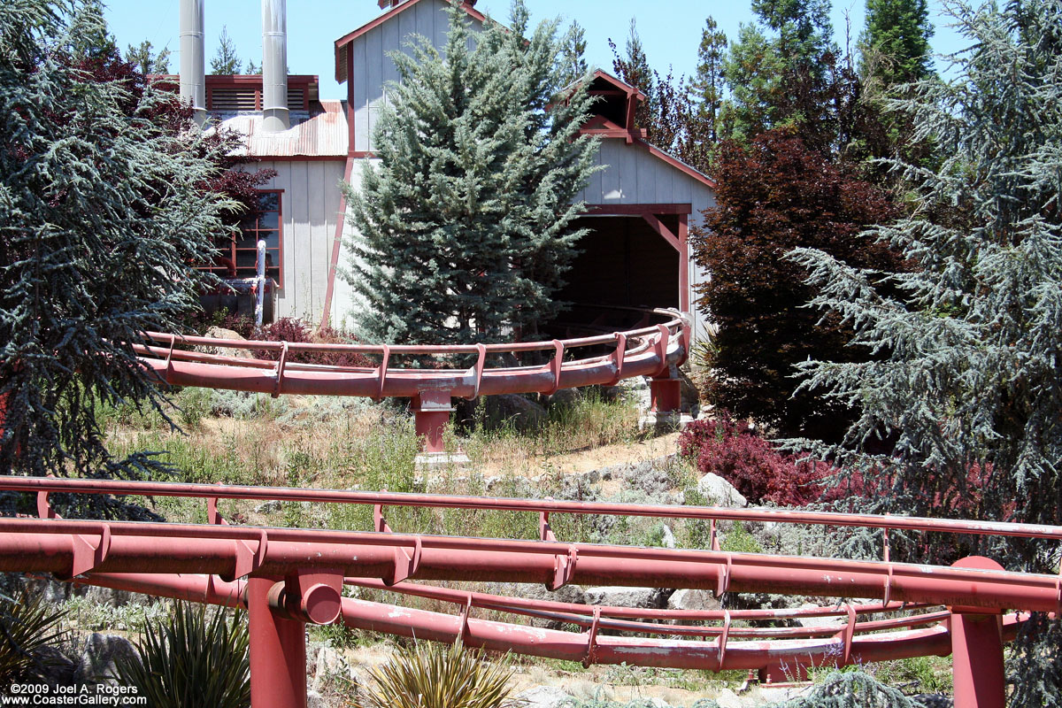 Roller coaster going into a building