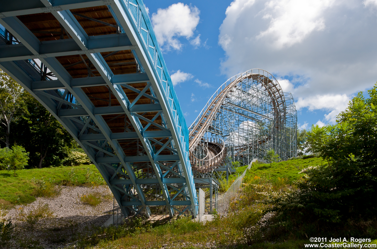 Roller coaster going over a bridge