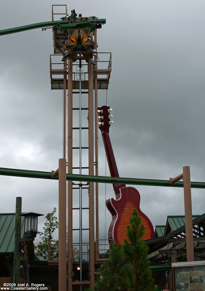 Hydraulic elevator lift used on a suspended roller coaster