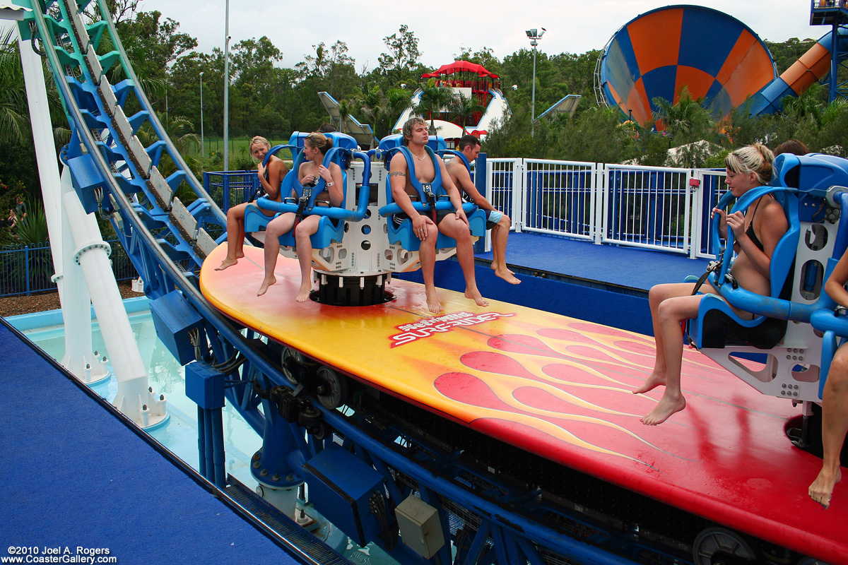 People in swim suits riding a roller coaster