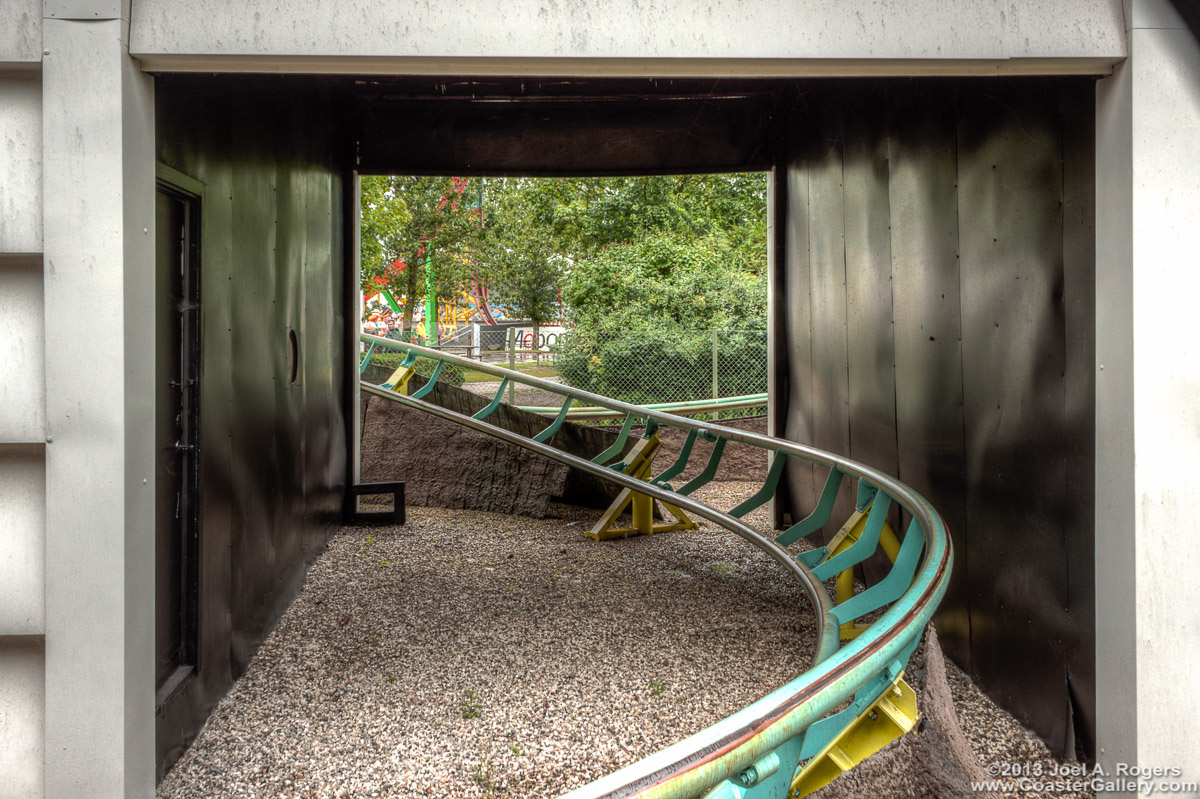 Roller coaster track in a tunnel.