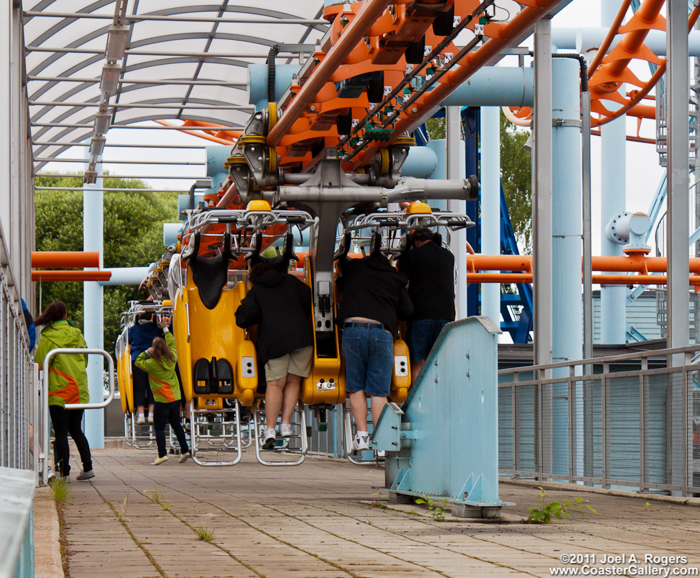 People disembarking a moving roller coaster
