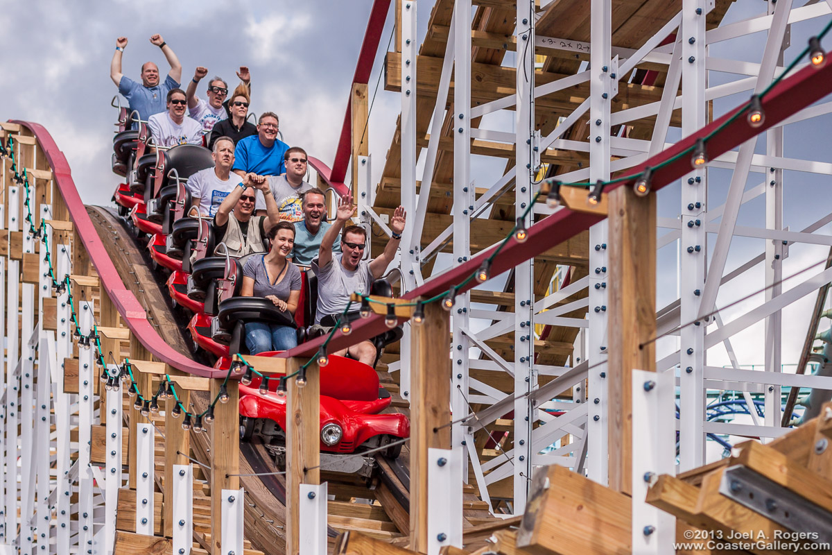 Articulated train on a twisted wooden coaster