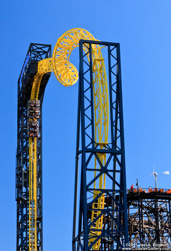 A roller coaster looping and rolling