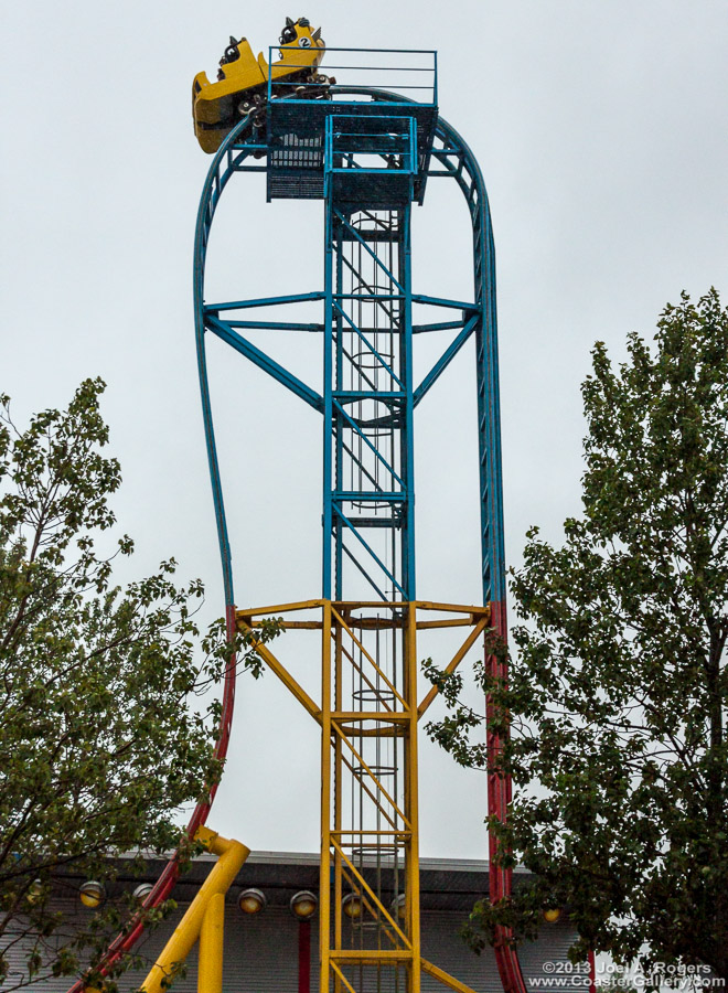 Roller coaster going over a vertical lift hill