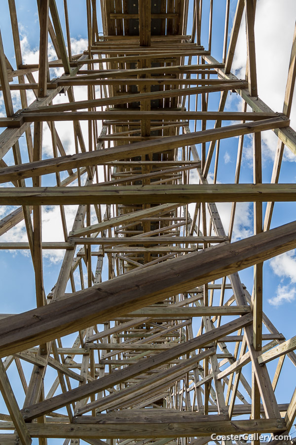 A picture taken under a lift hill of a roller coaster