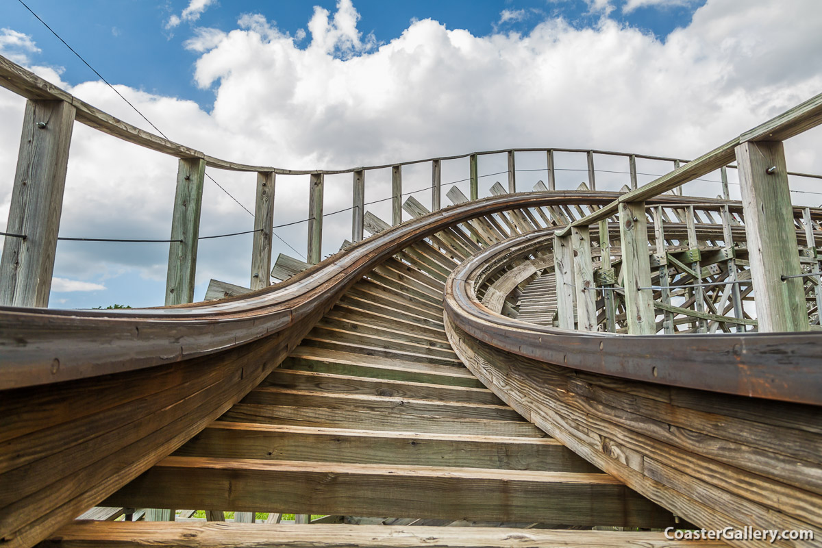 A close-up picture of wood roller coaster track