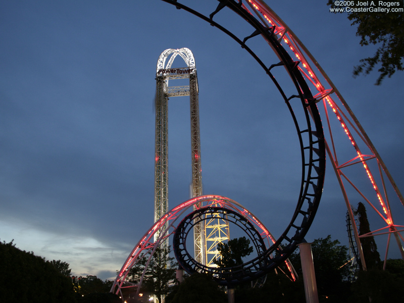 Corkscrew loops over the Midway at dusk