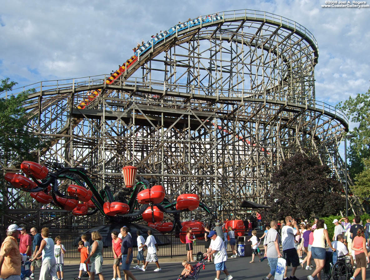Racing roller coaster in Sandusky, Ohio. Octopus ride in foreground.