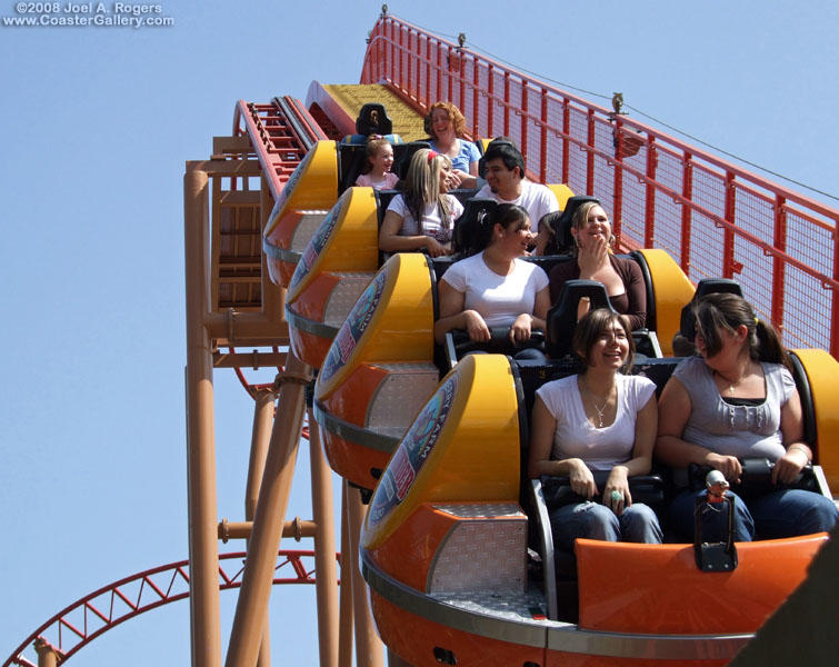 Train of roller coaster riders