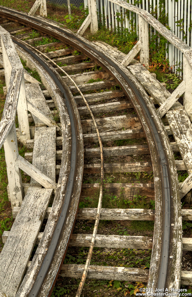 A very old coaster with peeling paint