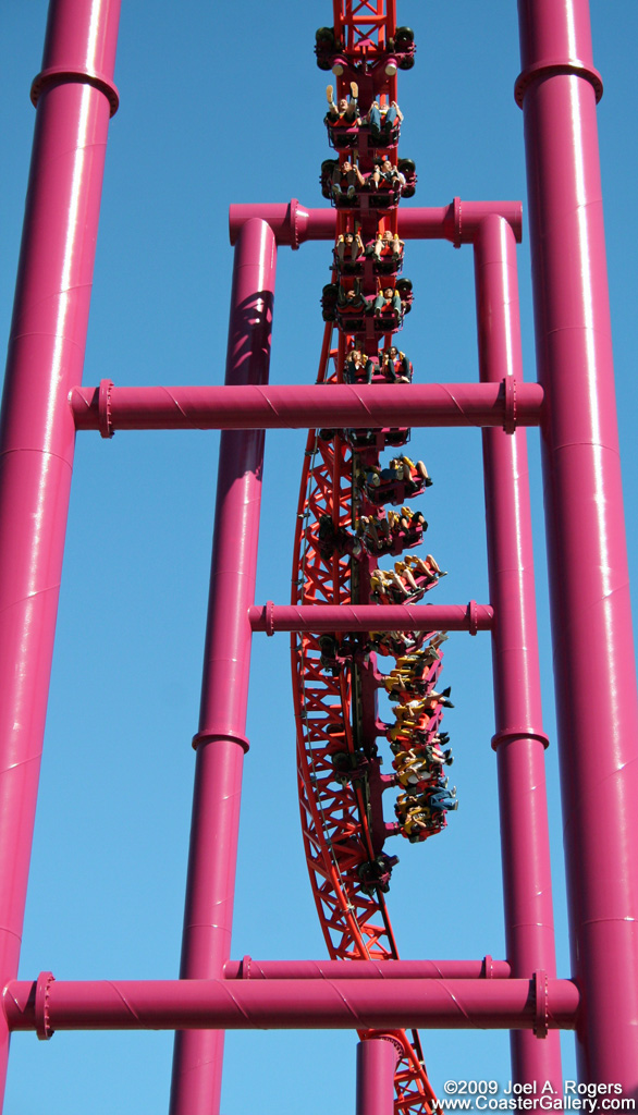 People hanging under roller coaster track