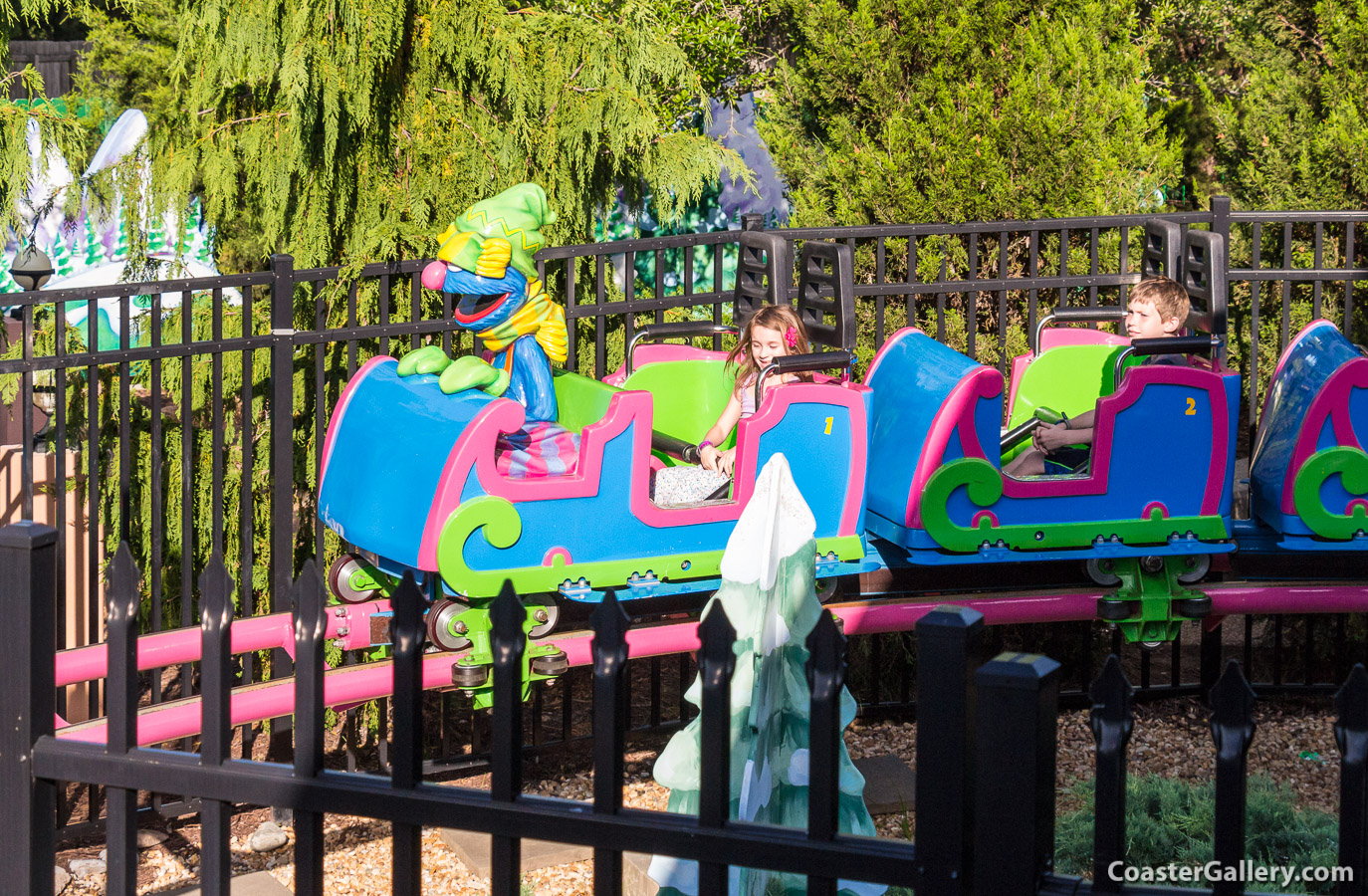 Pictures of Sesame Street's Grover riding the Grover's Alpine Express roller coaster at Busch Gardens Williamsburg