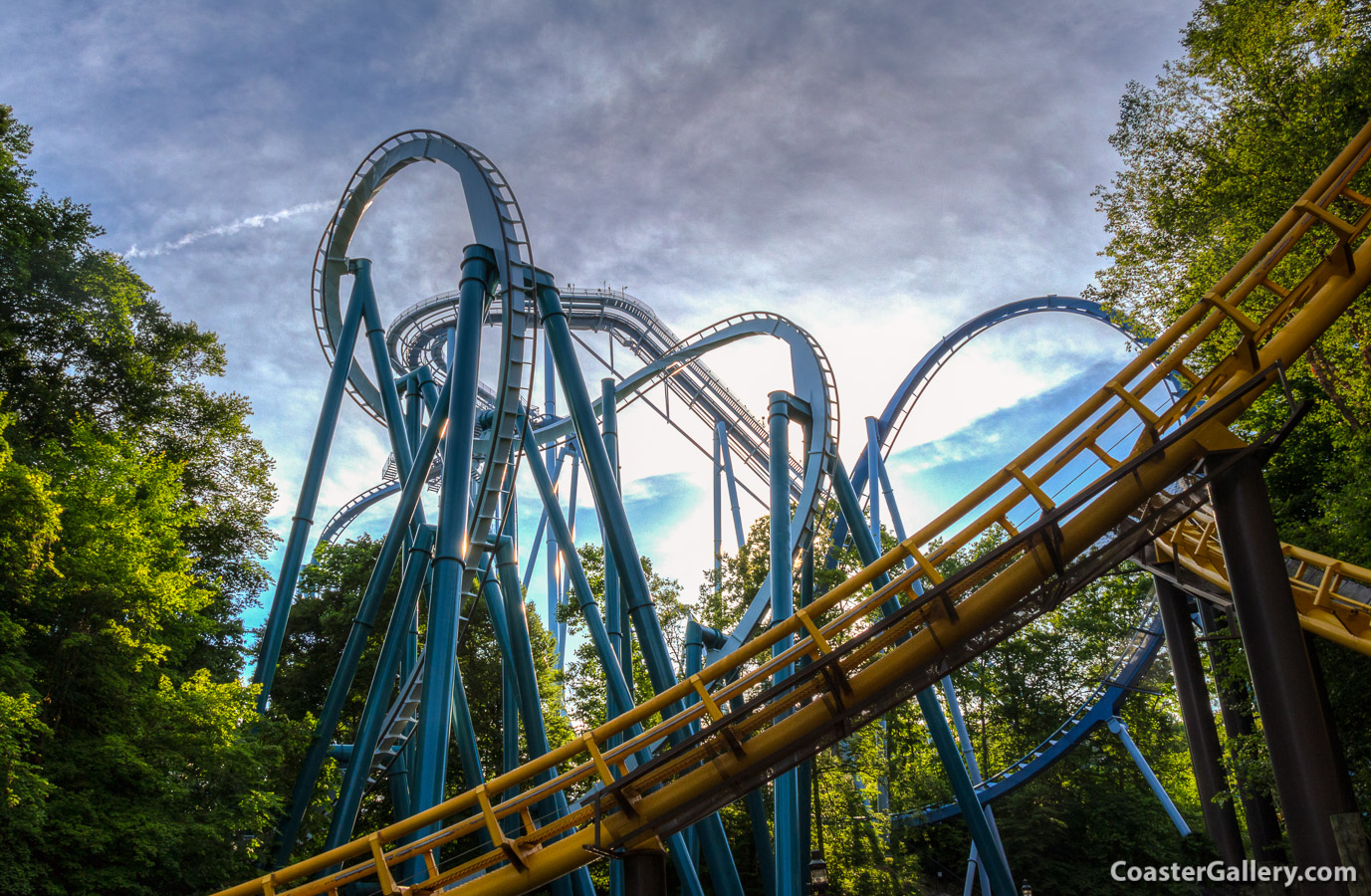 This shot shows a looping coaster, a record-setting inverted coaster, and the world's first floorless Dive Coaster.